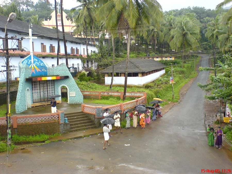 A tree-lined village road near the school